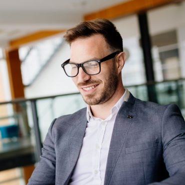 demo-attachment-316-businessman-taking-a-break-with-a-cup-of-coffee-JW4B3DH